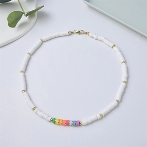 Bohemian white heishi clay bead necklace with rainbow accents and 18K gold-plated links