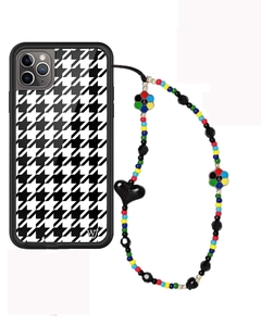 Detail of houndstooth phone case and colorful beaded lanyard with heart charms