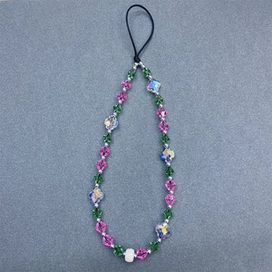 Handmade pink and green faceted crystal bead phone strap with iridescent cross charms