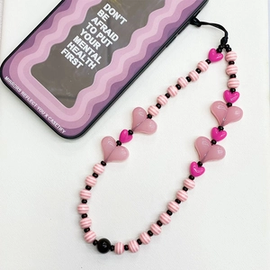 Pink heart beaded phone lanyard with striped beads and acrylic charms for wrist carry