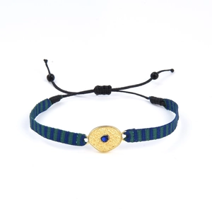Bracelet bohème tissé bleu-vert avec pendentif doré et pierre bleue centrale