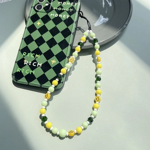 Mint green beaded phone strap with yellow smiley face and checkered money phone case