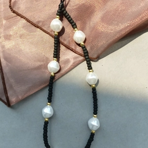 Handmade beaded phone strap with black frosted beads and baroque faux pearls