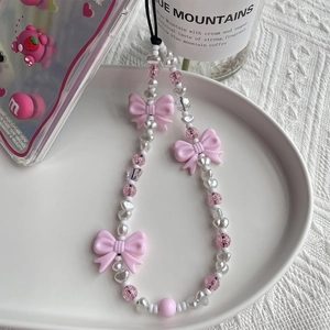 Charme de Téléphone Perlé Nœud Papillon Rose Doux Avec Künstliche Perle d'Imitation Dragonne Esthétique pour Femmes Filles Décoration