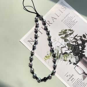 Bohemian style phone strap with metallic silver texture beads and sleek black accents