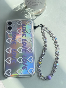 Detail of laser iridescent phone case with purple 3D LOVE text and beaded butterfly strap
