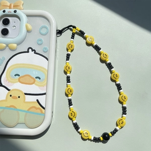 Handmade beaded phone strap with yellow smiley faces and matching cartoon duck phone case