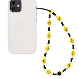 Handmade beaded phone strap with yellow smiley face beads and black accents on a white case