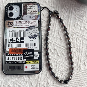 Industrial sticker style mirror phone case with black beaded skull charm wrist strap
