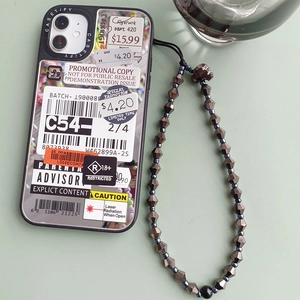 Detail of street-style phone case with barcode print and beaded skull wrist strap