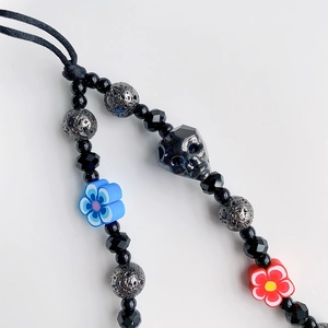 Bohemian crystal skull phone charm with handmade polymer clay flower beaded lanyard