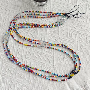Colorful beaded phone crossbody strap with mixed glass seed beads and clear faceted accents