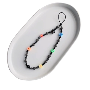 Bohemian crystal skull phone charm with colorful clay flowers and black beaded strap