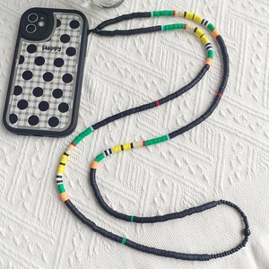 Bohemian style crossbody phone lanyard with colorful clay beads and checkered pattern case
