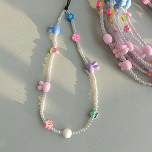 Handmade beaded phone strap featuring cute bunny charms and colorful smiley flower beads
