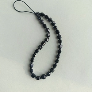 Minimalist black beaded lanyard with matte and faceted crystals for phones and cameras