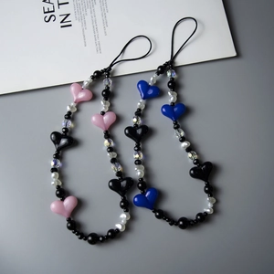Bohemian crystal heart beaded phone wrist strap in pink, black, and blue styles