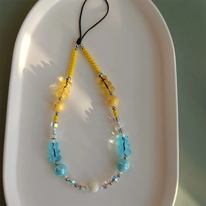 Detailed view of handmade beaded phone strap with cute gummy bear and crystal beads