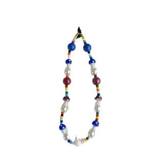 Colorful beaded iPhone wrist strap with polka dot mushroom charms and faux pearls