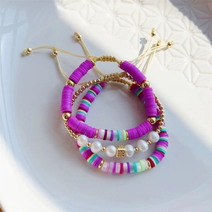Three-piece set of purple and colorful clay bead bracelets with natural pearls and gold beads