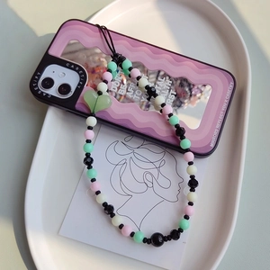 Beaded phone strap with pink, mint, black, and white beads and a green heart charm