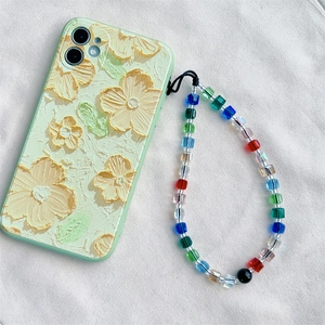 Floral embossed pale green phone case with colorful crystal beaded lanyard strap