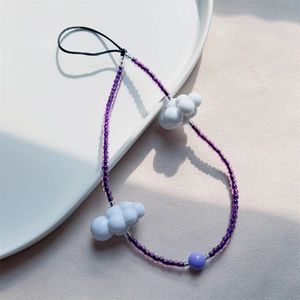 Handmade purple beaded phone strap featuring white cloud charms and translucent beads