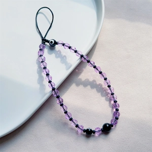 Handmade purple crystal beaded phone strap with mystic evil eye charm and black accents
