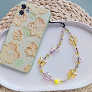 Detail of floral oil painting style phone case with colorful crystal butterfly bead strap