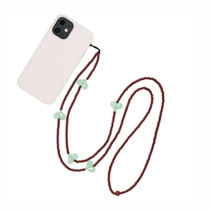 Crossbody phone charm strap with dark red beads and light green heart pendants