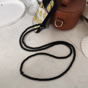 Crossbody black beaded Halloween skull phone strap with matte disc beads and metal hook