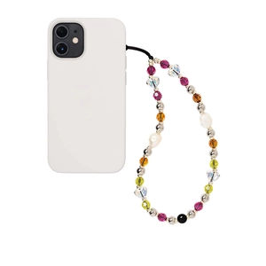 Detail of colorful crystal beaded phone strap with heart beads and faux pearls on white case