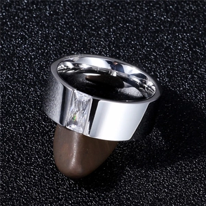 Detailed macro shot of 8mm silver steel ring with rectangle zircon on natural stone