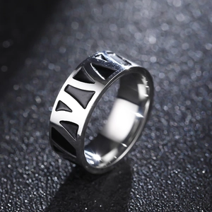 Vintage stainless steel ring with black geometric giraffe pattern and polished finish
