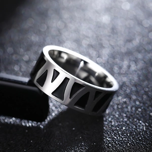 Vintage stainless steel ring featuring Roman numeral engravings and a wide band design
