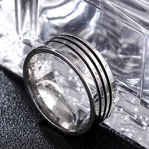 Men's vintage stainless steel ring with three parallel black matte grooves on silver band