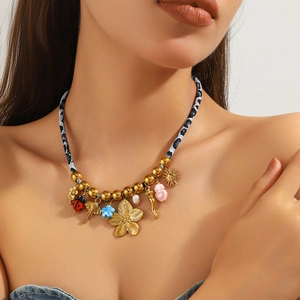 Bohemian gold-tone starfish and shell necklace with leopard fabric cord and colorful charms