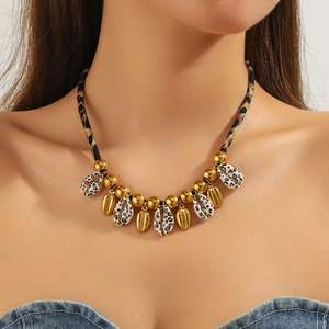Bohemian seashell and starfish necklace featuring leopard print lanyard and gold beads