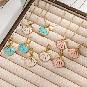 Shell jewelry set with pearl necklaces and earrings in white, blue and pink