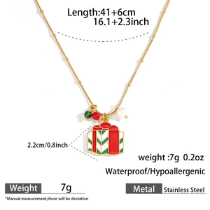 Detail shot of golden stainless steel Christmas necklace with red gift box pendant details
