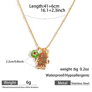Detail view of gold stainless steel gingerbread man necklace with 41+6cm length and 6g weight