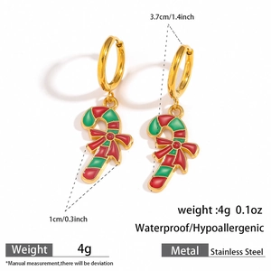Detail view of 3.7cm candy cane earrings in stainless steel with red bow accents