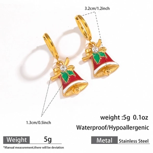 Close-up of golden stainless steel Christmas bell earrings with red enamel and zircon