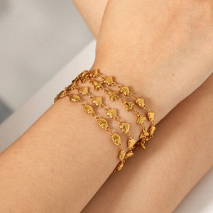 Layered 18k gold stainless steel bracelet with shell, fishtail, and heart charms