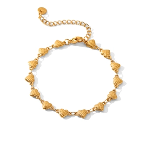 Close-up of 18k gold heart bracelet showing textured mesh pattern and adjustable chain