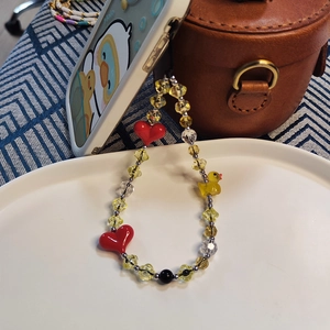 Cute beaded phone strap with yellow duck, heart charm and star beads for women