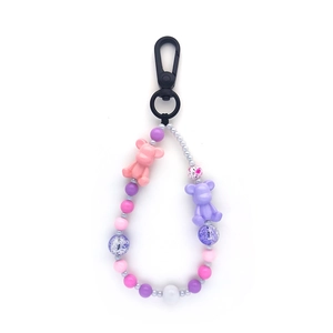 Handmade beaded teddy bear keychain with pink and purple macarons beads and black carabiner