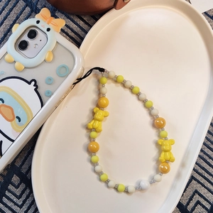 Detail of colorful resin beaded phone strap with cute yellow bears and nylon cord