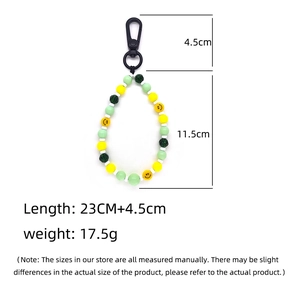 Handmade beaded keychain with yellow smiley face beads and green lime aesthetic charms