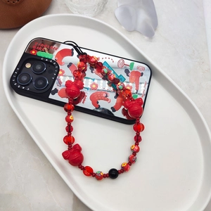 Handmade red crystal beaded phone strap with festive bell and cartoon mirror iPhone case